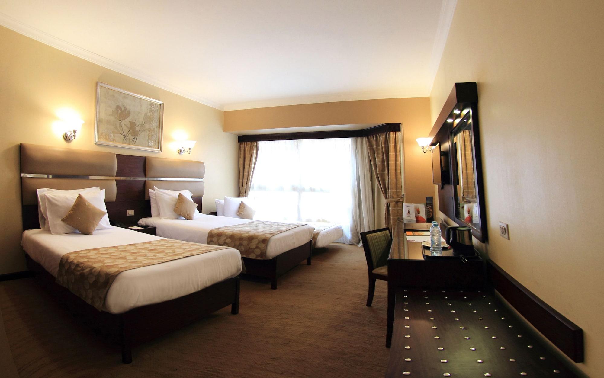 Pyramisa Suites Hotel Cairo Giza Exterior photo A room at the hotel