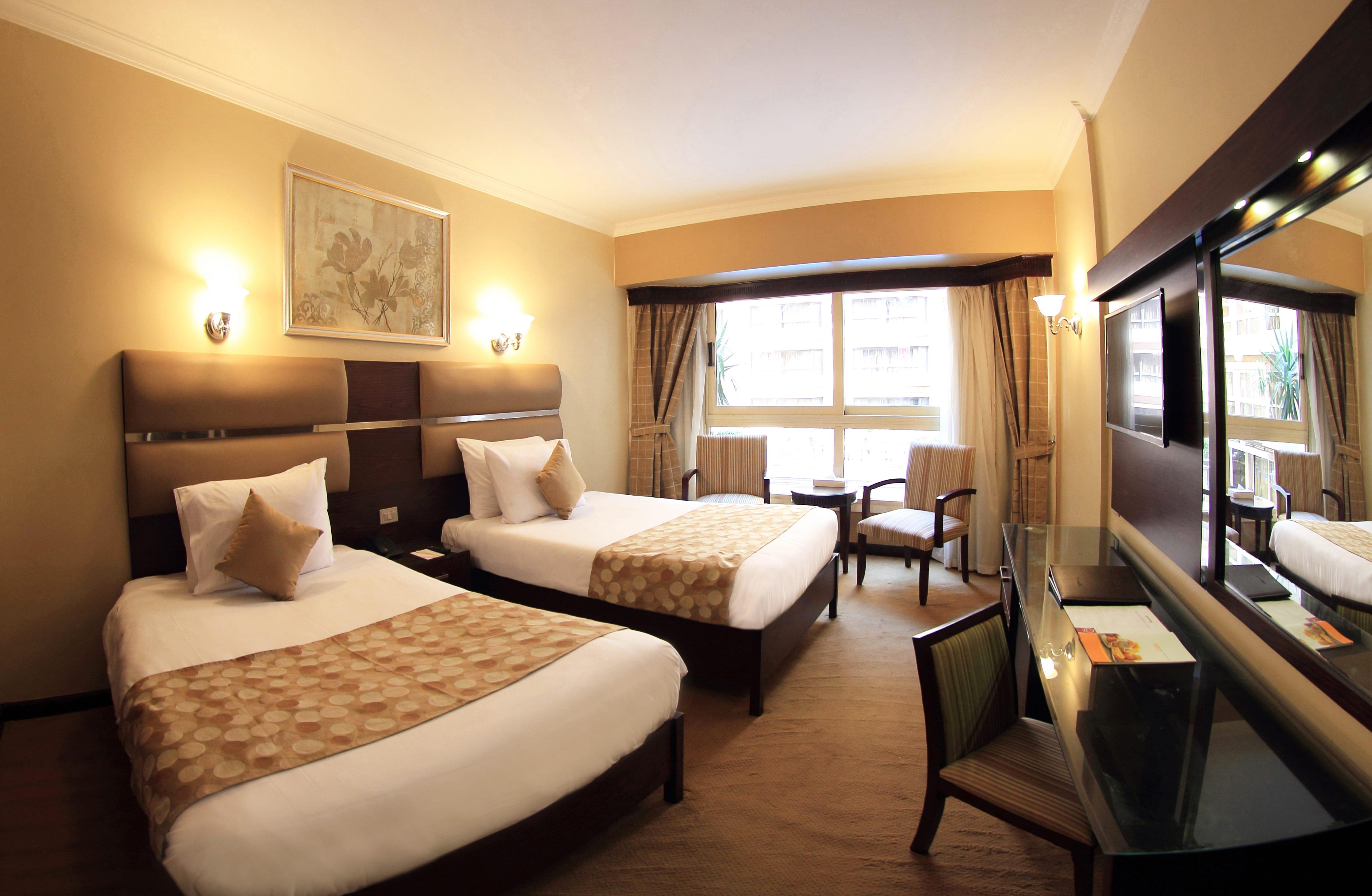 Pyramisa Suites Hotel Cairo Giza Exterior photo A room at the hotel